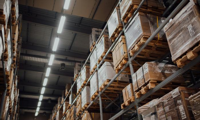 Brown cardboard boxes stacked on a warehouse rack